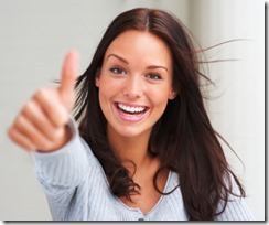 Portrait of attractive young female showing a thumbs up